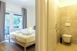 Shower, hair dryer, towels, toilet paper