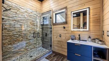 Shower, hair dryer, towels, shampoo