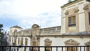 A row of historic buildings with ornate facades and balconies. - Downtown Apartment with Parking and Terrace (Córdoba)