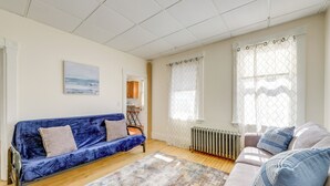 A living room with a blue sofa, a grey sofa, and a patterned rug. - 1/2 Mi to Ocean: Cozy Apt in Old Orchard Beach (Old Orchard Beach)