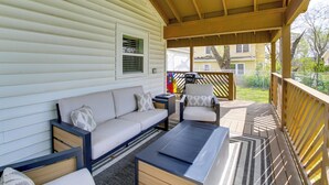 A covered outdoor seating area with a sofa, armchairs, and a coffee table. - Walk to Casino: Home w/ Deck in Hot Springs! (Hot Springs)
