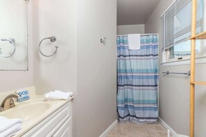 Shower, hair dryer, towels