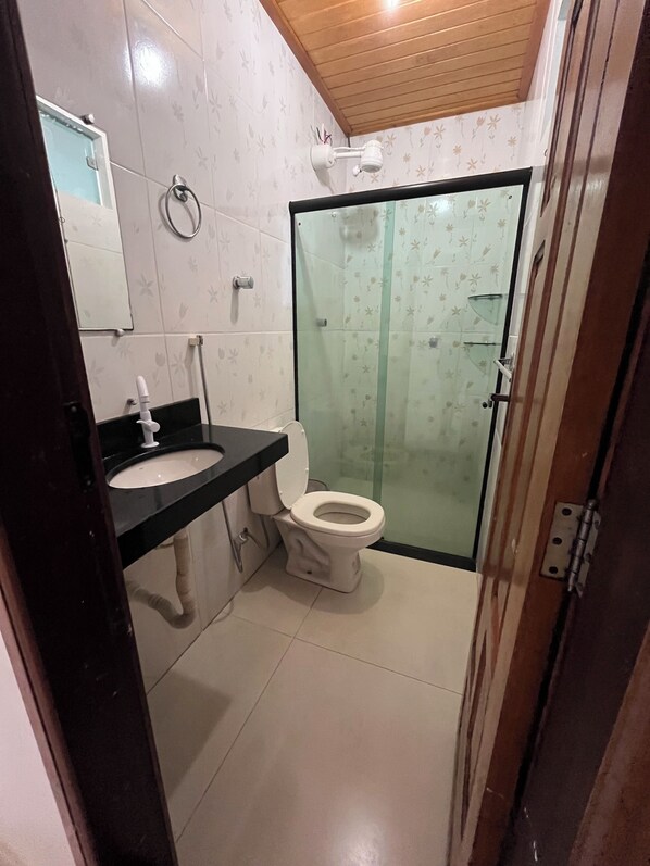 Shower, towels, soap, toilet paper