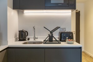 Fridge, microwave, toaster, cookware/dishes/utensils