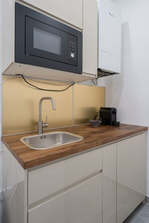 Fridge, microwave, stovetop, coffee/tea maker