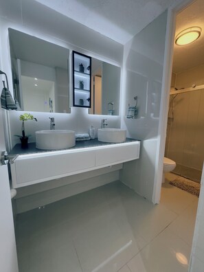 Shower, hair dryer, towels, soap