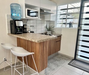 Fridge, microwave, stovetop, coffee/tea maker