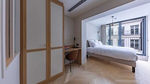 A bedroom with a bed, a desk, a chair, and a wardrobe. - Opera - One bedroom apt. with balcony in Paris (Paris)