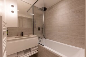 Shower, hair dryer, towels, shampoo