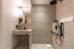 Shower, hair dryer, towels, shampoo
