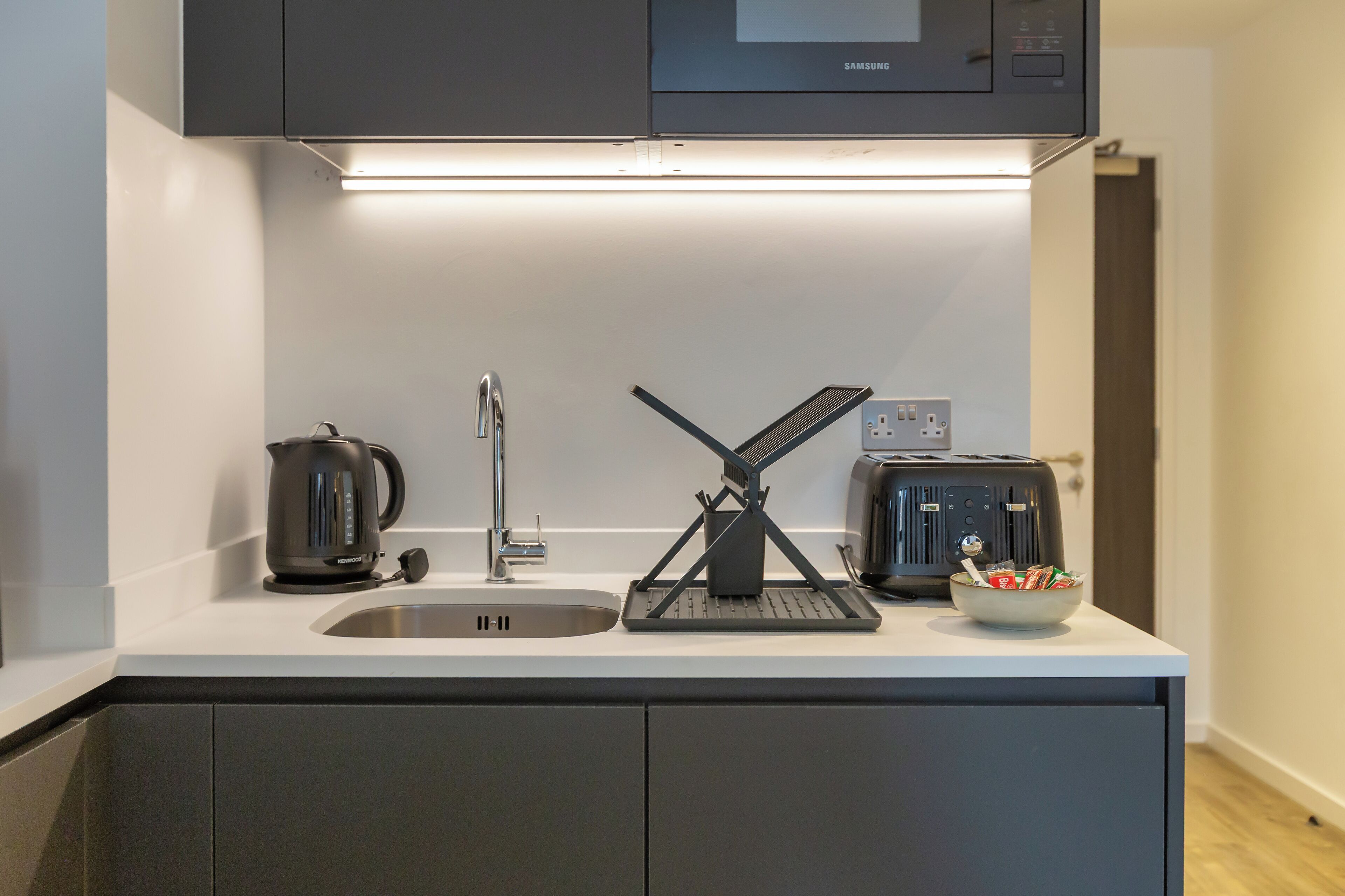 Fridge, microwave, toaster, cookware/dishes/utensils