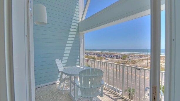 A balcony with a view of the beach and ocean. - NEW! Beachside Bliss in Orange Beach (Orange Beach)