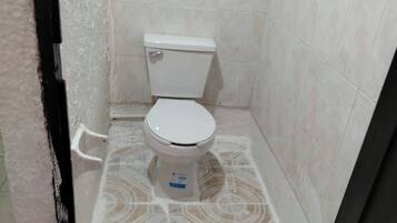 Shower, towels, soap, toilet paper