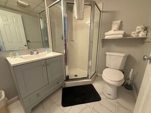 Shower, towels, soap, toilet paper