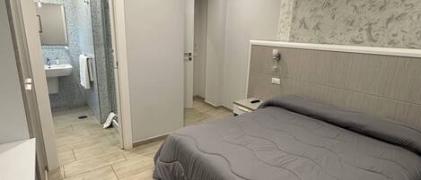 1 غرفة نوم ومكواة/لوح كي وواي فاي وملاءات أسرّة