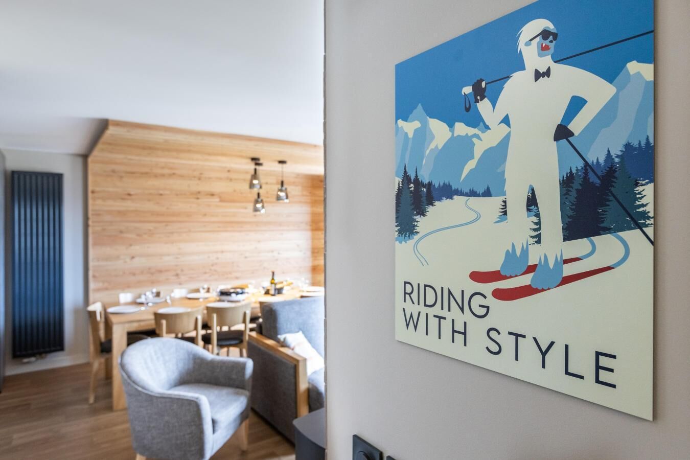 A modern dining area with wooden paneling and a minimalist design.