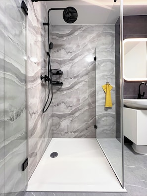 Shower, hair dryer, towels, soap
