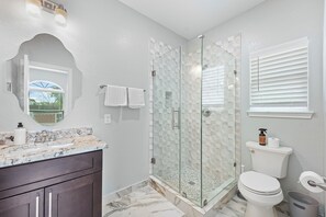 Shower, towels, soap, toilet paper