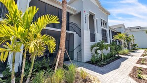 A modern building with a white exterior, a balcony, and a number '15265' on the side. - 2 bed 2 bath GOLF condo in Webbs Reserve (Punta Gorda)
