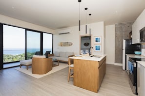 Luxury Apartment, Balcony, Ocean View | Living area | 50-inch Smart TV with cable channels - Arihini Deluxe Apartments (Roatan)