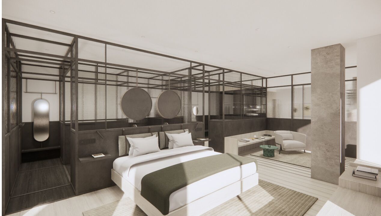 أغطية فراش متميزة وميني بار وخزنة داخل الغرفة ومكتب