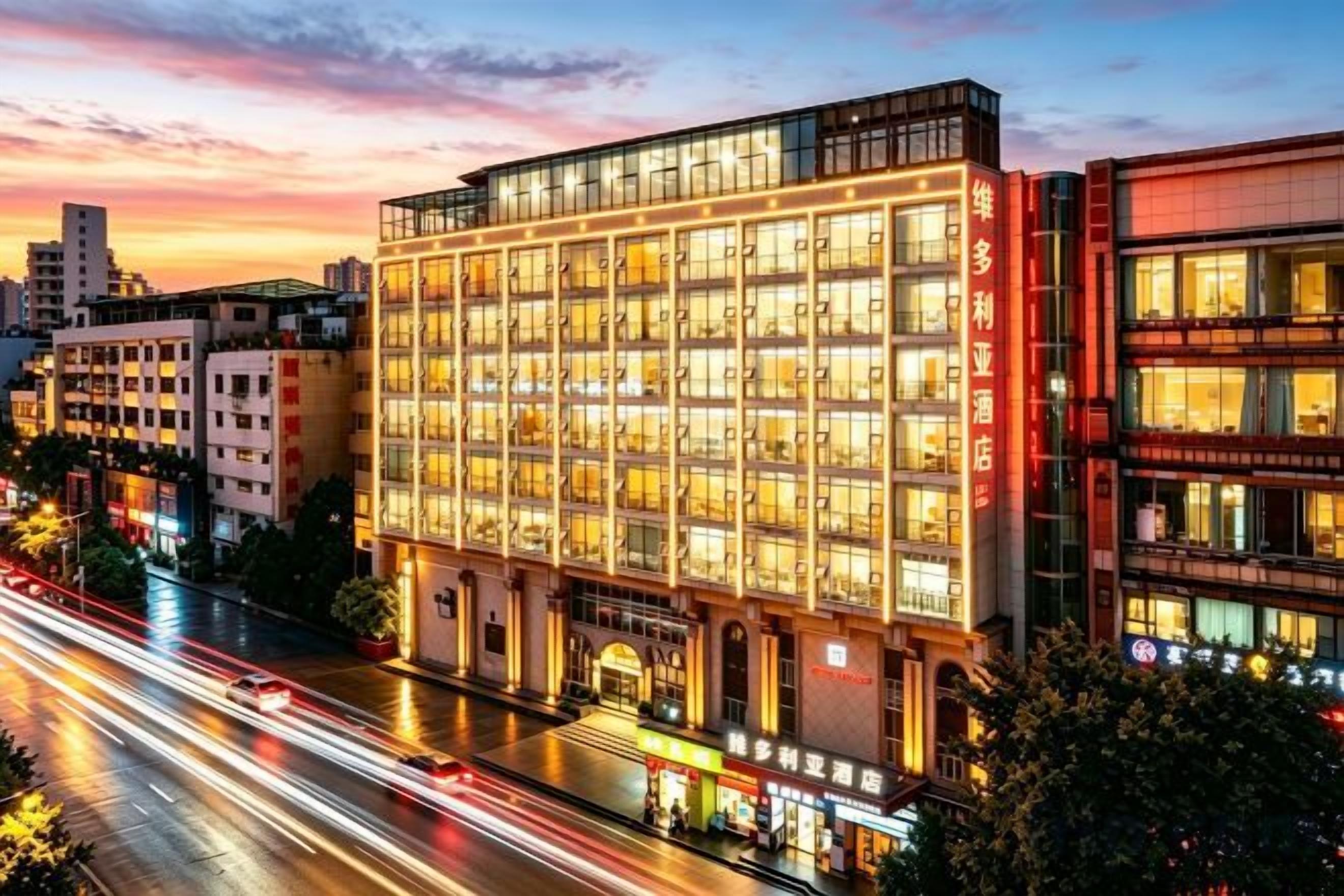 A multi-story hotel with a modern facade, large windows, and a prominent entrance.