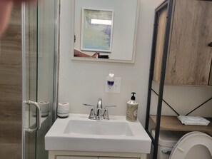 Shower, towels, soap, toilet paper