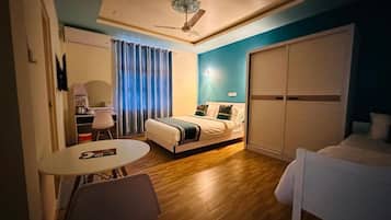 Deluxe Quadruple Room, Garden View | Desk, soundproofing, free WiFi