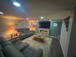 Smart TV, fireplace, books