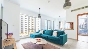 Comfort Apartment, Balcony, City View | Living area | 50-inch Smart TV with digital channels