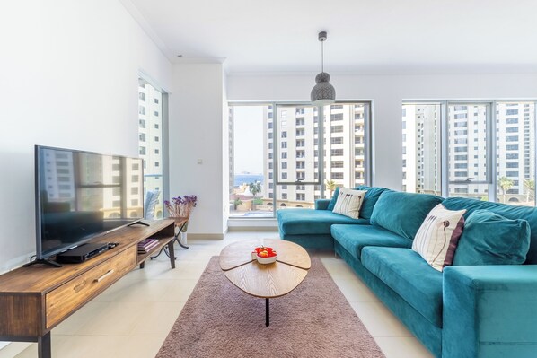 Comfort Apartment, Balcony, City View | Living area | 50-inch Smart TV with digital channels