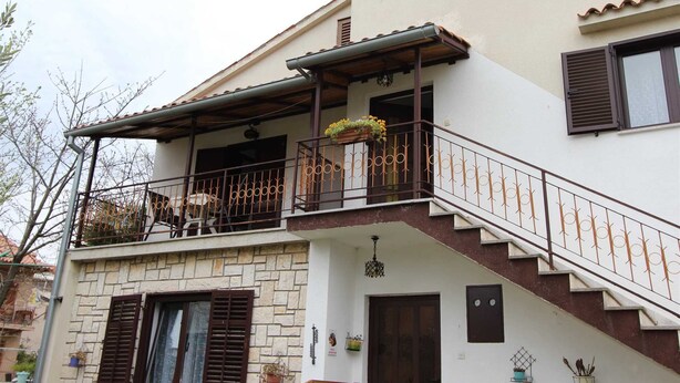 A two-story building with a balcony, a staircase, and a door. - ROSANNA 2 Studio with Balcony (Rovinj)