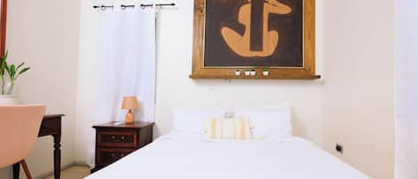 1 bedroom, desk, iron/ironing board, travel crib