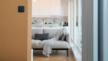 Superior Apartment, Balcony, City View | Living area | 50-inch Smart TV with cable channels, Netflix, streaming services