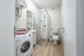 Shower, hair dryer, towels, soap