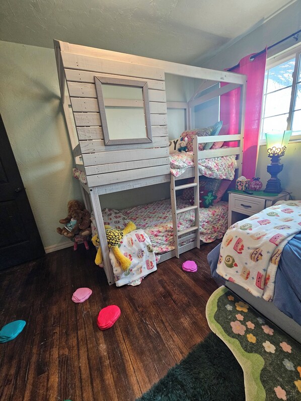 A child's bunk bed with a mirror, toys, and a lamp. - Whimsical 3 bd cottage for families and pets. Sleeps 7, free wifi/snacks (Midwest City)
