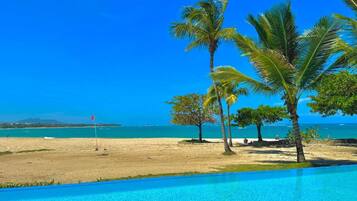 On the beach, sun-loungers, beach towels