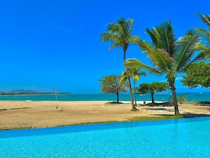 On the beach, sun loungers, beach towels