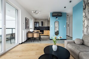 Luxury Apartment, Balcony, City View | Living area | 50-inch Smart TV with cable channels, Netflix, streaming services - Sky by Kairos Apartments (Katowice)