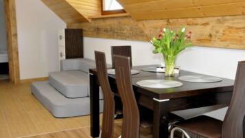 Desk, laptop workspace, blackout drapes, iron/ironing board