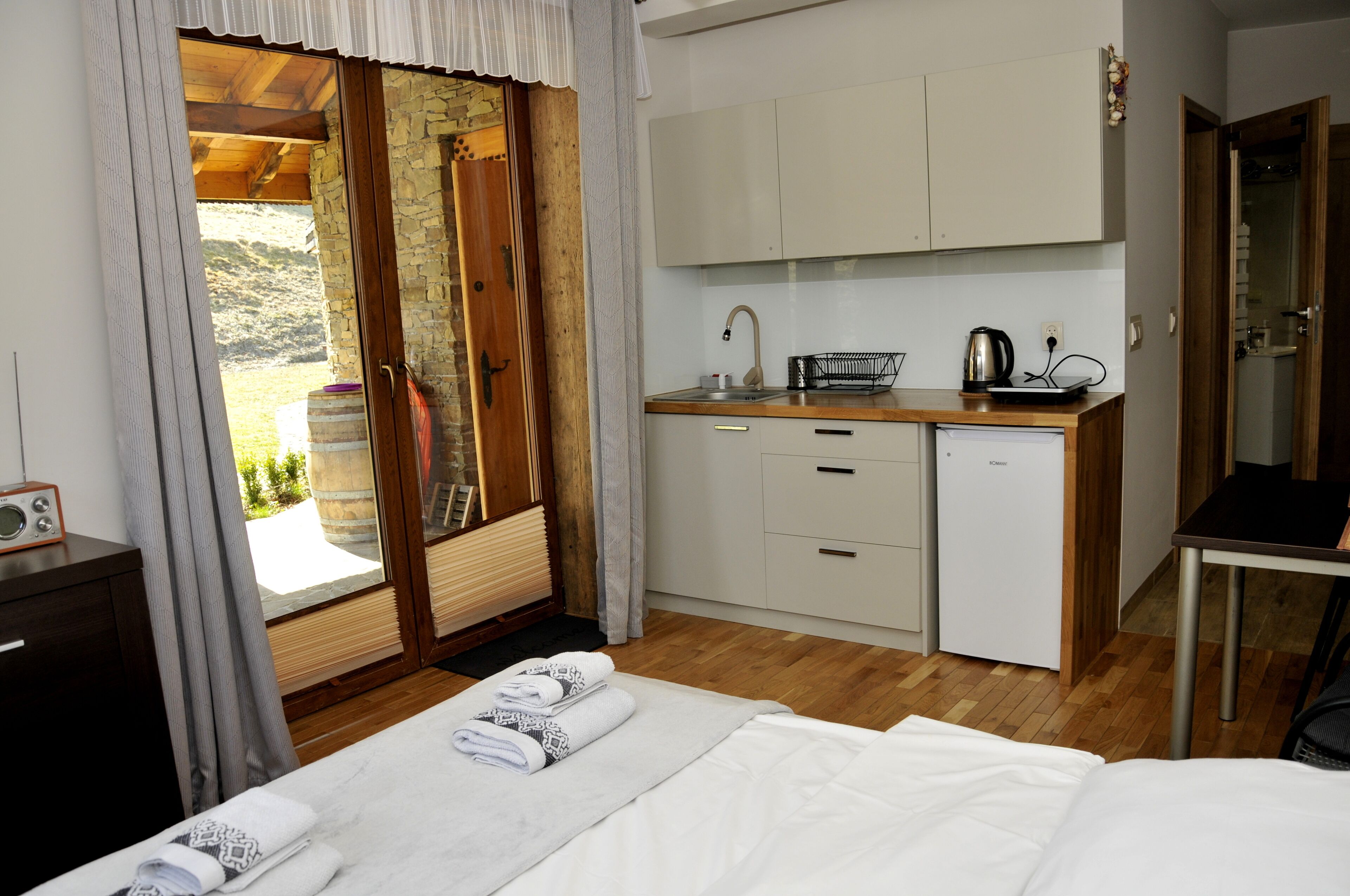 Desk, laptop workspace, blackout drapes, iron/ironing board