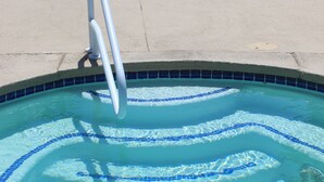 A swimming pool with a diving board, a no diving sign, and a depth marker of 3 1/2 feet.