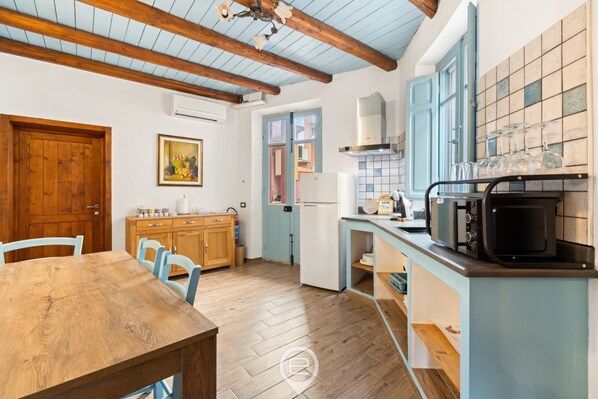 Fridge, microwave, coffee/tea maker, dining tables