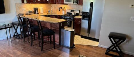 Coffee/tea maker, fridge, microwave, oven