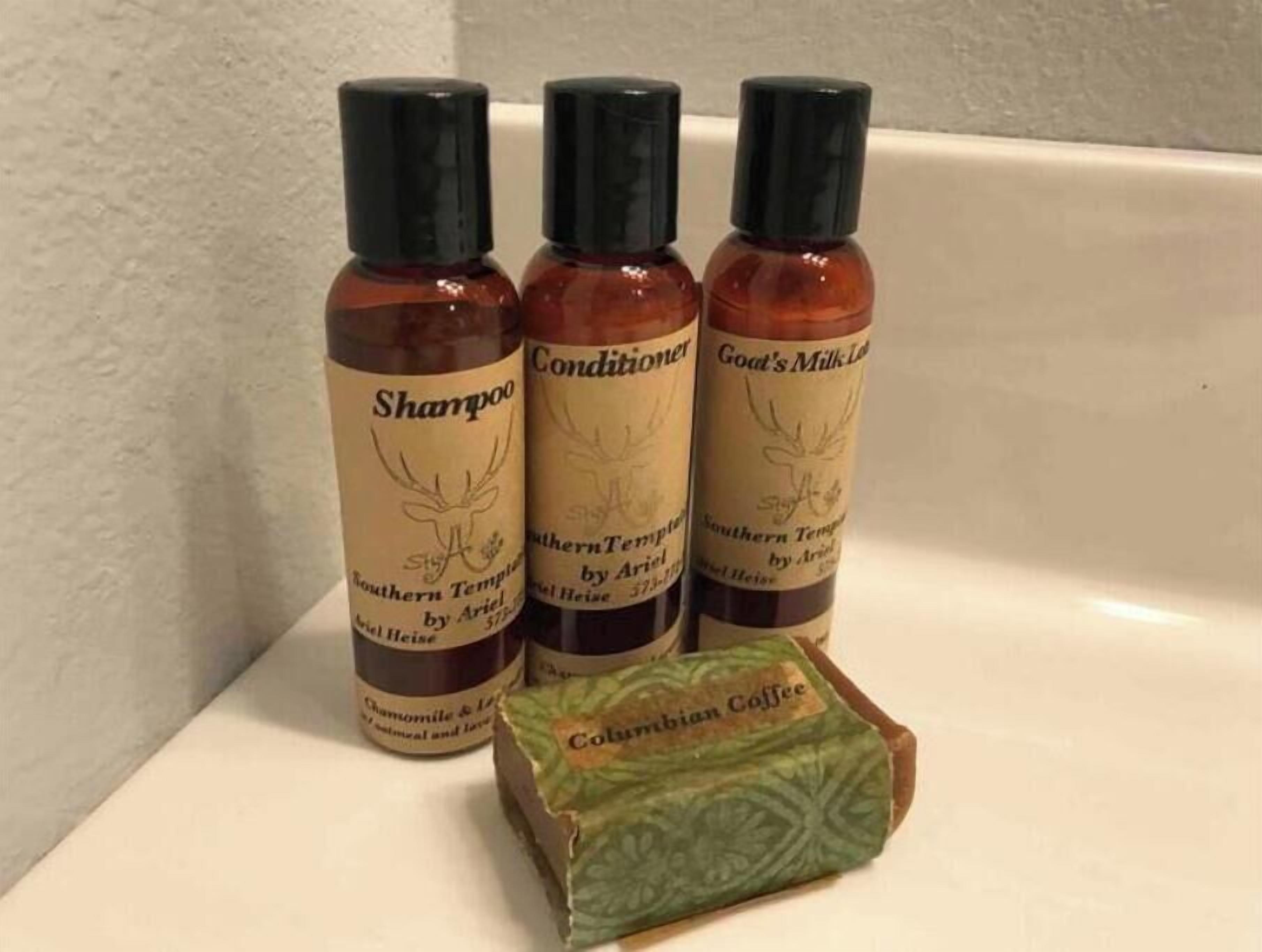 Three bottles of Southern Tempered by Ariel hair care products and a box of Columbian Coffee.