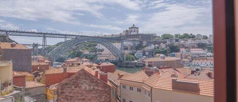 A view of a cityscape with buildings and a bridge.