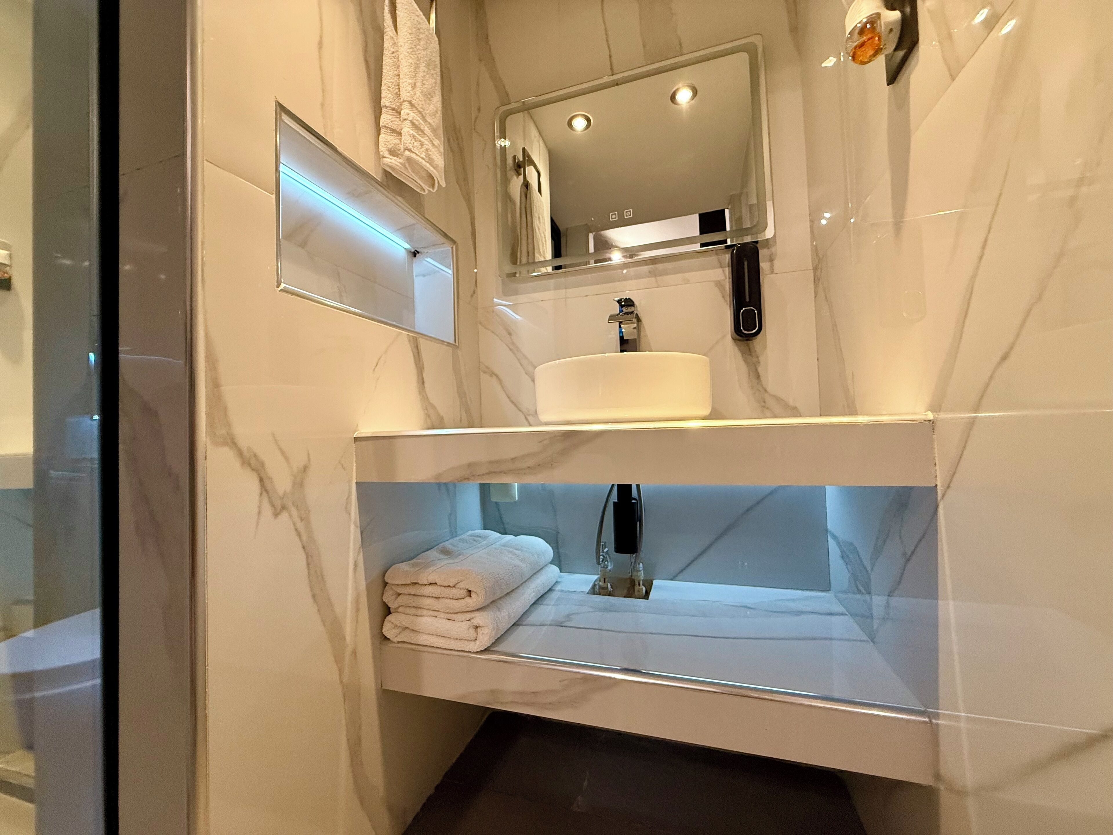 Shower, towels, soap, toilet paper