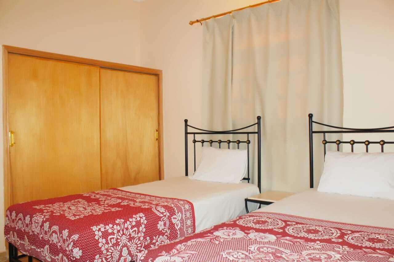 Apartment, 2 Bedrooms | Desk, laptop workspace, blackout drapes, free WiFi