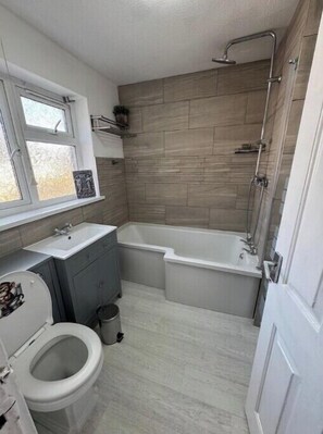 Shower, hair dryer, towels, shampoo
