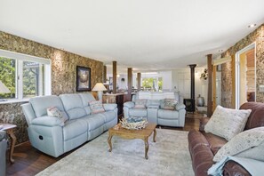 A living room with two sofas, a coffee table, and a fireplace. - Sale- Golf Course Getaway-Message for Discount on 2 courses on property (Lima)